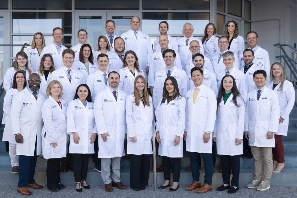 An outdoor group shot of otolaryngology faculty